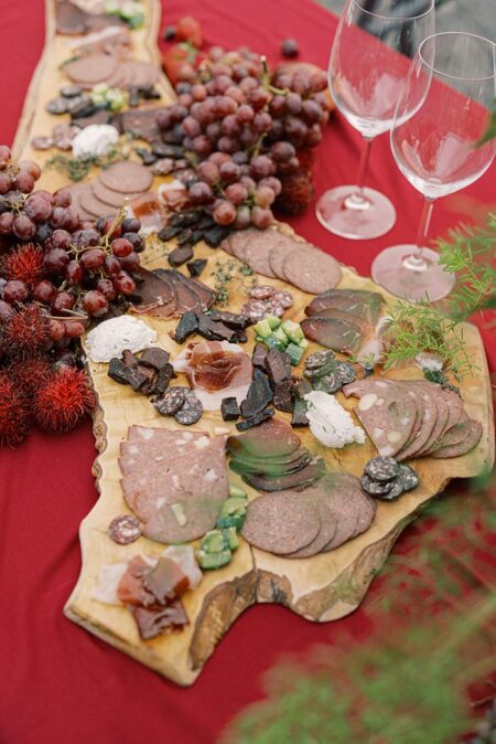 Aperitifs arranged on a charcuterie board featuring Parker Ranch meats